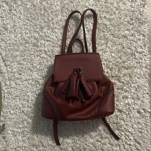 Burgundy backpack with tassle
